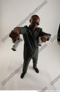 ERIC STANDING POSE WITH GUNS